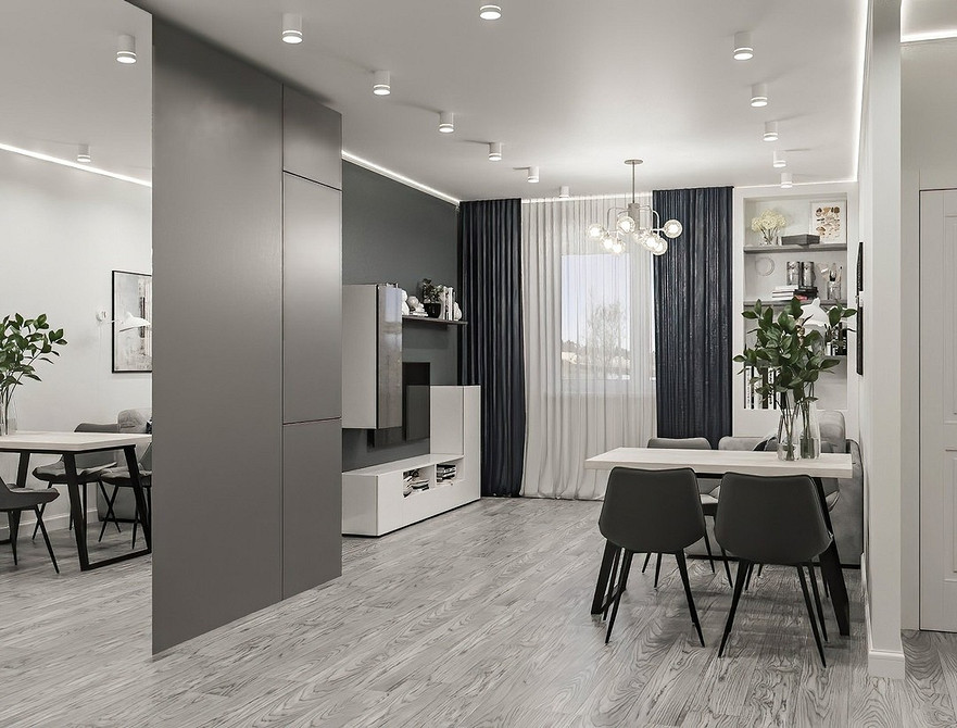 Сучасна вітальня з дзеркальною шафою для зберігання та стильного дизайну.