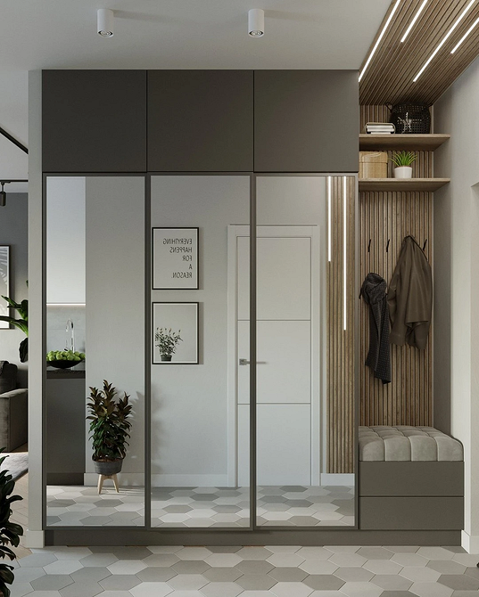 Дзеркальна шафа з матовим склом: сучасний дизайн та приємне освітлення у вітальні.