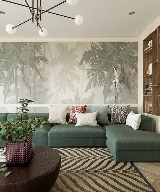 Зелений диван оливкового кольору у вітальні з білими стінами та великими вікнами.