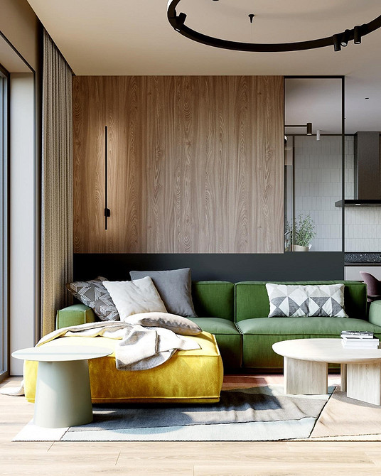 Зелений диван в дитячій кімнаті з яскравими іграшками та текстилем.