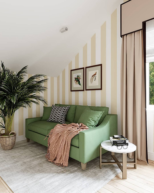 Сучасний інтер'єр з великим смарагдовим диваном та яскравими декоративними подушками у 2026