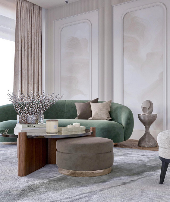 Зелений шкіряний диван в кабінеті з дерев'яними панелями та великою бібліотекою.