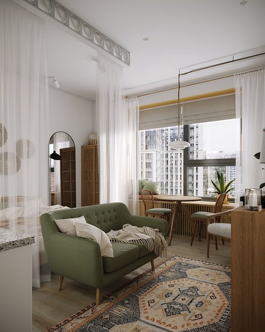 Оливковий диван у світлій вітальні, ідеальне рішення для невеликої квартири